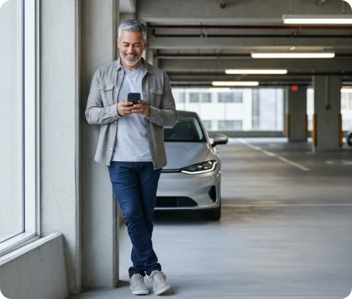 A resident using the ParkEase residential parking solution in a modern garage to manage his digital permit and receive real-time updates without using physical stickers.